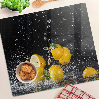 Glass kitchen board Lemons in water