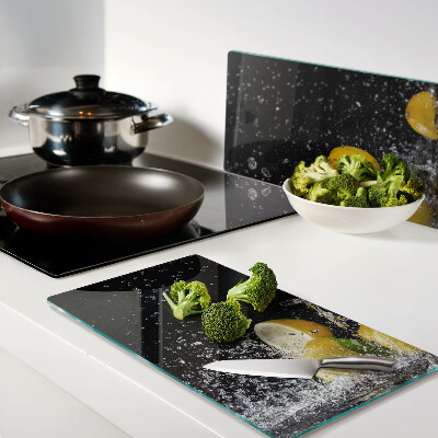 Glass kitchen board Lemons in water