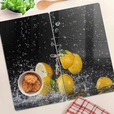 Glass kitchen board Lemons in water