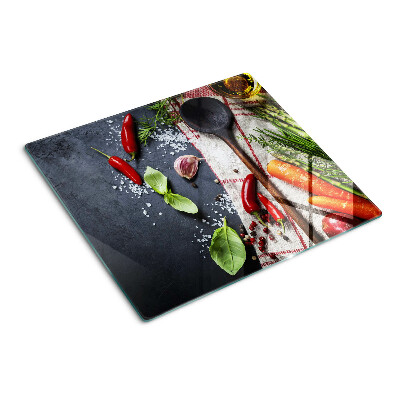 Glass chopping board Kitchen spices and vegetables