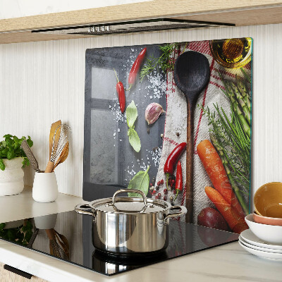 Glass chopping board Kitchen spices and vegetables