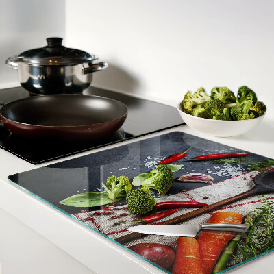 Glass chopping board Kitchen spices and vegetables