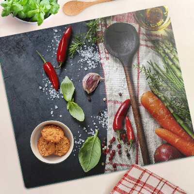 Glass chopping board Kitchen spices and vegetables
