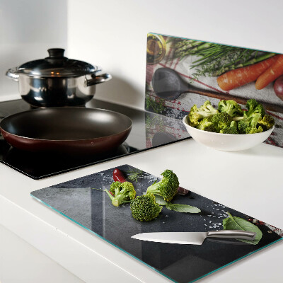 Glass chopping board Kitchen spices and vegetables