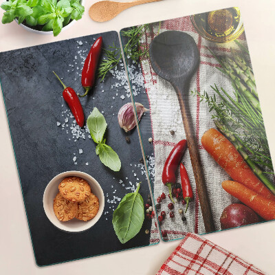 Glass chopping board Kitchen spices and vegetables