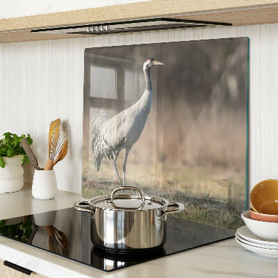 Glass kitchen board A crane against the backdrop of a landscape