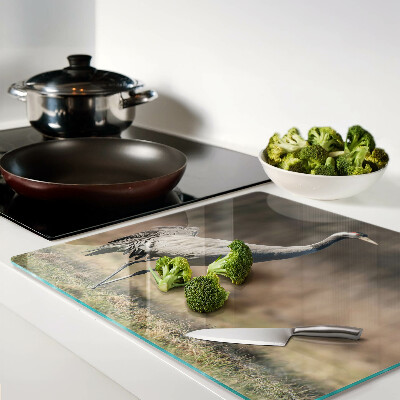 Glass kitchen board A crane against the backdrop of a landscape