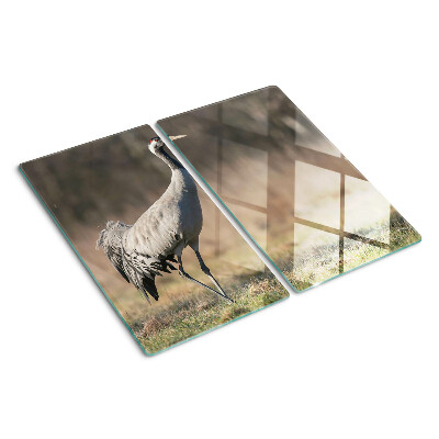 Glass kitchen board A crane against the backdrop of a landscape