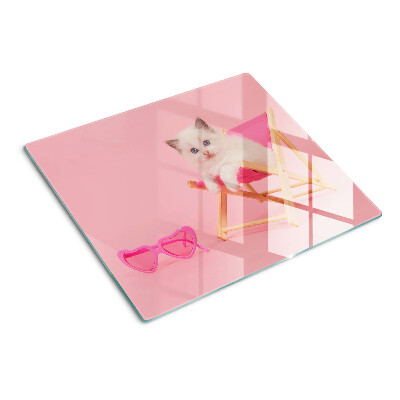 Glass chopping board Kitten on a deckchair on a pink background