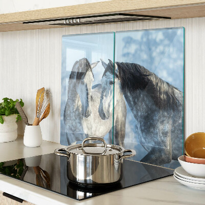 Glass kitchen board Horses in a winter landscape