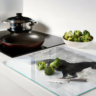 Glass chopping board A horse in a winter landscape