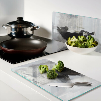 Glass chopping board A horse in a winter landscape