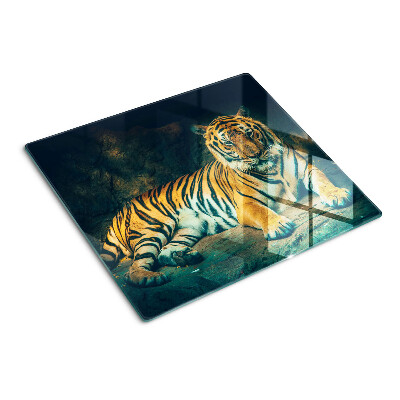 Glass kitchen board Tiger lying on the rocks