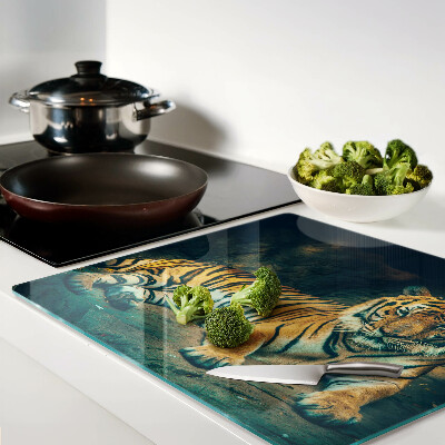 Glass kitchen board Tiger lying on the rocks