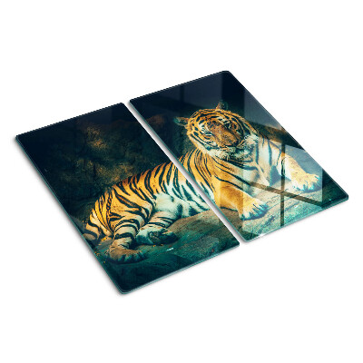 Glass kitchen board Tiger lying on the rocks