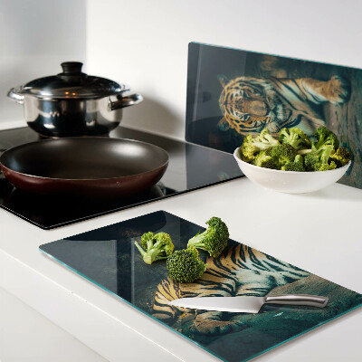 Glass kitchen board Tiger lying on the rocks