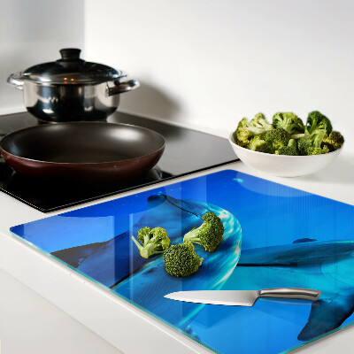 Glass kitchen board Dolphins in the water