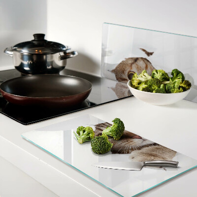 Glass chopping board A cat coming out of a hole