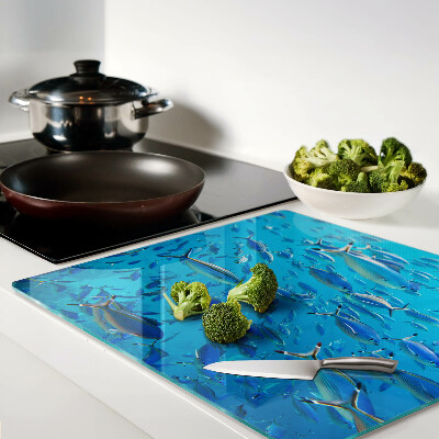 Glass chopping board A school of fish in clear water