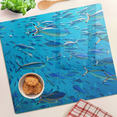 Glass chopping board A school of fish in clear water