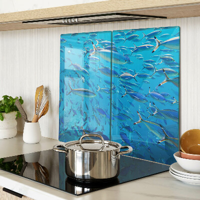 Glass chopping board A school of fish in clear water