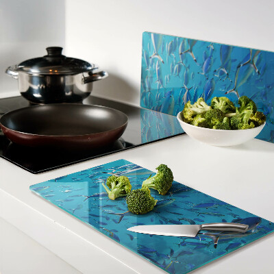 Glass chopping board A school of fish in clear water