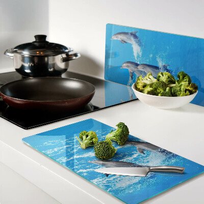 Glass kitchen board Dolphins jumping over waves