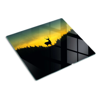 Glass kitchen board Deer against the backdrop of the setting sun
