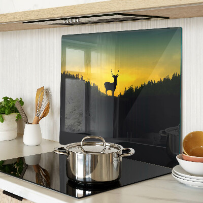 Glass kitchen board Deer against the backdrop of the setting sun