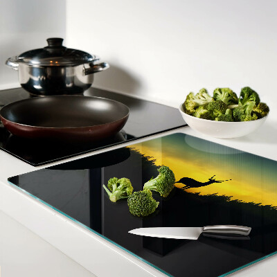 Glass kitchen board Deer against the backdrop of the setting sun