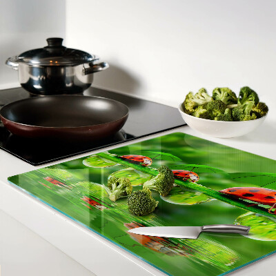 Glass chopping board Ladybugs on leaves with water drops