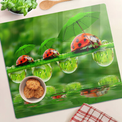 Glass chopping board Ladybugs on leaves with water drops
