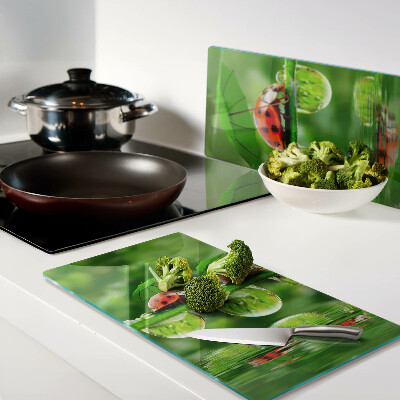 Glass chopping board Ladybugs on leaves with water drops