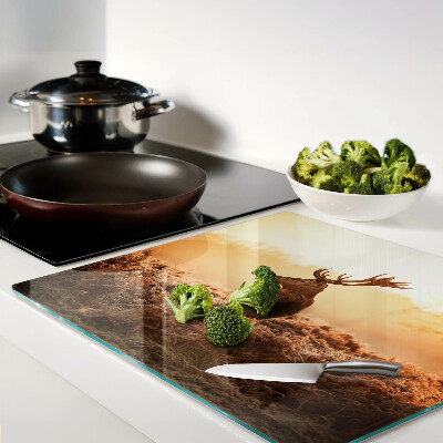 Glass kitchen board Deer against the backdrop of the sunset