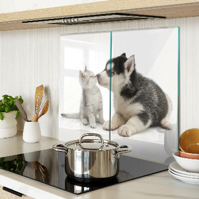 Glass kitchen board Kitten and puppy in friendship