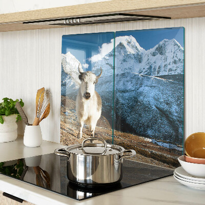Glass kitchen board Cow in the mountains