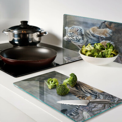 Glass kitchen board Tiger on a tree trunk
