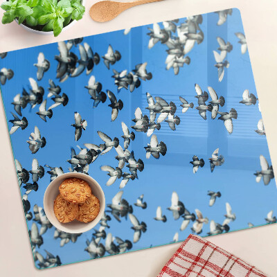Glass chopping board Pigeons flying in the sky
