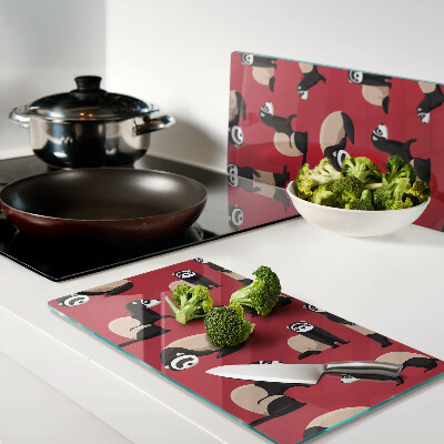 Glass kitchen board Ferrets on a red background
