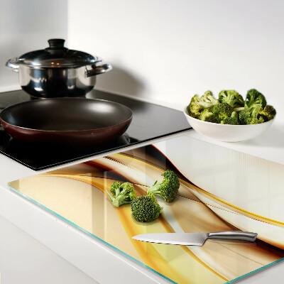 Glass kitchen board Abstract waves in shades of gold