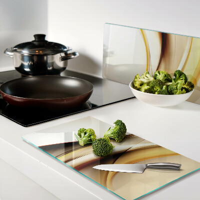 Glass kitchen board Abstract waves in shades of gold
