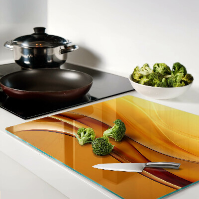 Glass kitchen board Waves in shades of gold