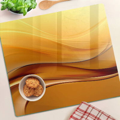 Glass kitchen board Waves in shades of gold
