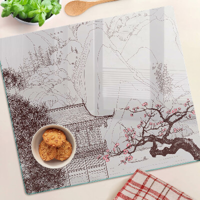 Glass kitchen board Mountain landscape with flowering trees