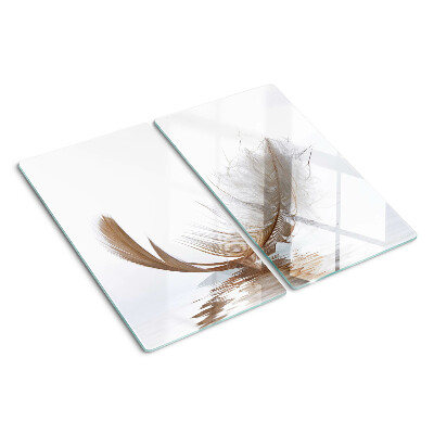 Glass chopping board Feather on the water background