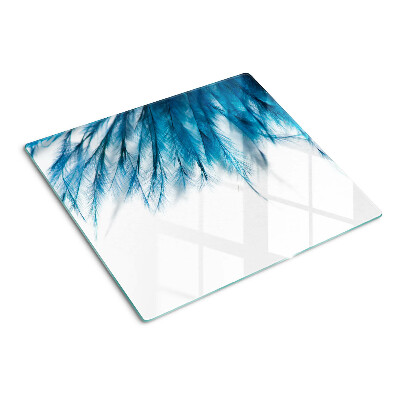 Glass kitchen board Blue feathers on white background