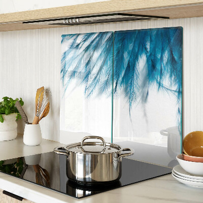 Glass kitchen board Blue feathers on white background
