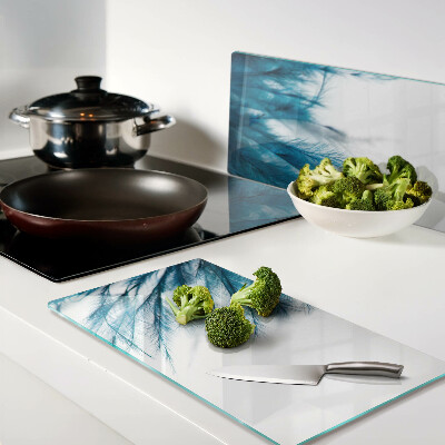 Glass kitchen board Blue feathers on white background