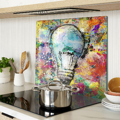 Glass kitchen board Light bulb on a colored background