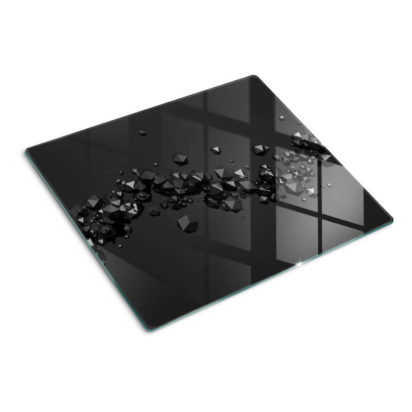 Glass kitchen board Black crystals on the background